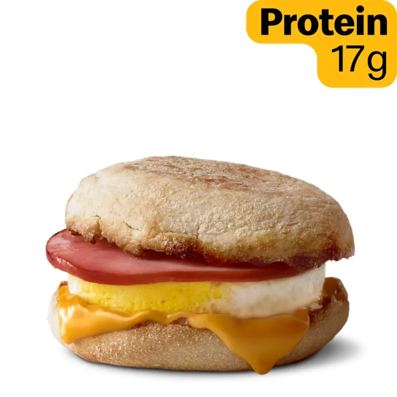 [vc_row height="small"][vc_column width="1/1"][vc_column_text] Egg McMuffin [/vc_column_text][vc_row_inner content_placement="middle"][vc_column_inner width="1/2"][us_image image="234" link="%7B%22url%22%3A%22%22%7D"][/vc_column_inner][vc_column_inner width="1/2"][vc_column_text]Egg McMuffin is a popular breakfast sandwich from McDonald's. It has a toasted English muffin. Inside, there is a round egg, melted cheese, and a slice of Canadian bacon. The egg is freshly cracked and cooked in a special ring. This gives it a perfect round shape. The cheese is creamy and melts well. The Canadian bacon adds a light, salty taste. Everything is warm and fresh when served. The sandwich is soft outside and fluffy inside. It is small but very filling. People often eat it with coffee or juice. It is easy to hold and eat quickly. Many people choose it for a fast morning meal. It is simple, tasty, and satisfying. This sandwich is loved by both kids and adults. It is one of McDonald's most famous breakfast items worldwide.[/vc_column_text][/vc_column_inner][/vc_row_inner][/vc_column][/vc_row][vc_row height="small"][vc_column width="1/1"][vc_column_text] Nutritional Information [/vc_column_text][us_separator size="custom" height="20px"][vc_column_text] 310 Cal. Calories 17g Protein 30g Total Carbs (11% DV) 13g Total Fat (17% DV) Saturated Fat: 6g (31% DV) Trans Fat: 0g Cholesterol: 250mg (83% DV) Dietary Fiber: 2g (6% DV) Total Sugars: 3g Added Sugars: 1g (2% DV) Vitamin D: 2mcg (15% DV) Calcium: 170mg (15% DV) Iron: 3mg (15% DV) Potassium: 200mg (4% DV) Sodium: 770mg (33% DV) [/vc_column_text][/vc_column][/vc_row][vc_row height="small"][vc_column width="1/1"][vc_column_text] Ingredient Breakdown [/vc_column_text][us_separator size="custom" height="20px"][vc_column_text] SANDWICH COMPONENT MAIN INGREDIENTS ALLERGEN INFORMATION Toasted English Muffin Enriched wheat flour, water, yeast, corn meal, sugar, salt. Contains wheat and may contain sesame. Fresh Round Egg Grade A eggs. Contains egg. Lean Canadian Bacon Pork, water, sugar, salt, natural flavor. No major allergens. Melted American Cheese Milk, cream, water, sodium citrate, salt, cheese cultures. Contains milk and soy. Salted and Clarified Butter Pasteurized cream, salt. Contains milk. Egg McMuffin